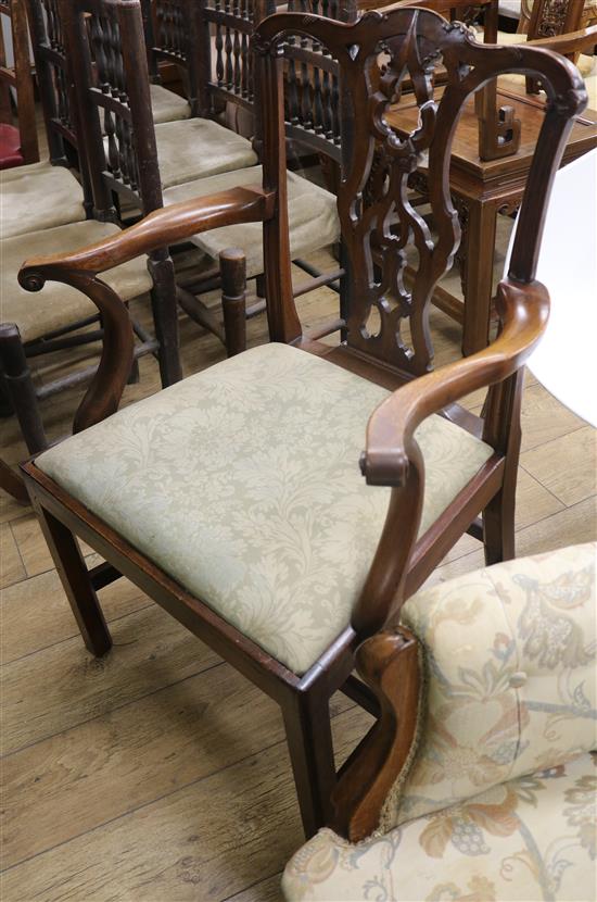 An early George III mahogany open armchair, with scrolled arm terminals